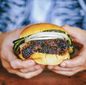 BBQ burger held in hands